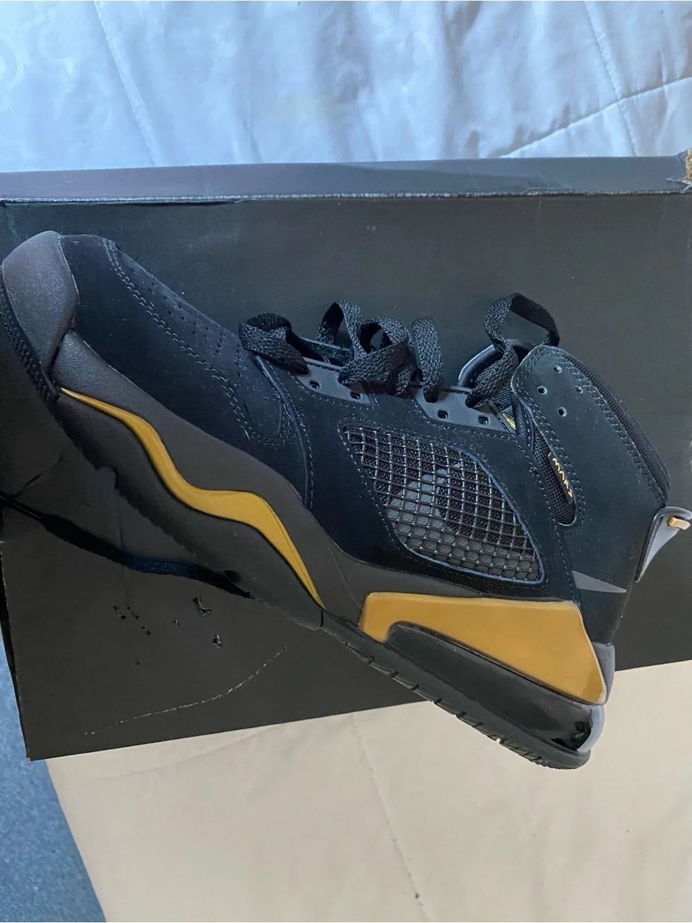 Jordan Men's Black Suede Sneakers with Gold Accent